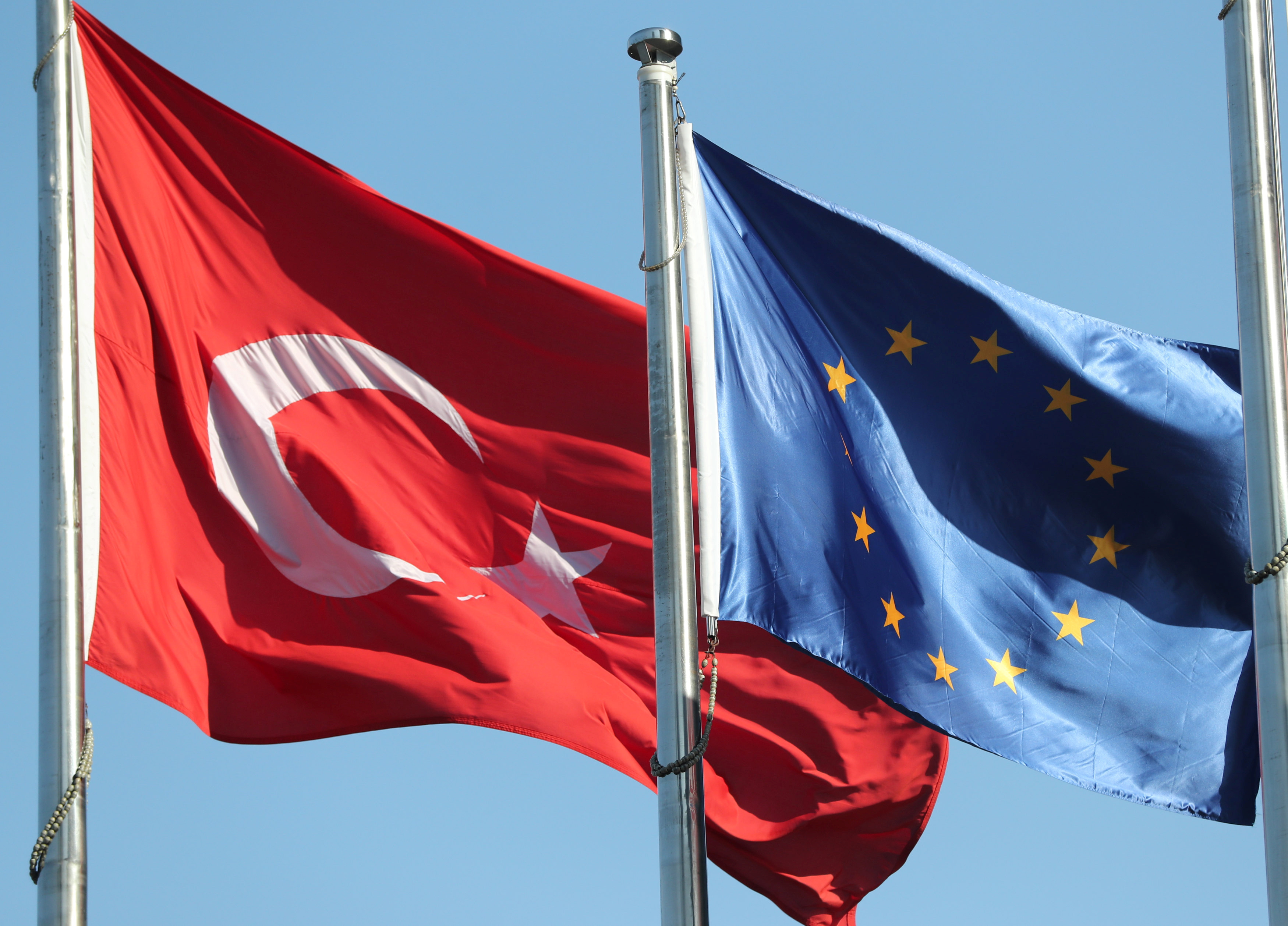 European Union and Turkish flags fly at the business and financial district of Levent in Istanbul