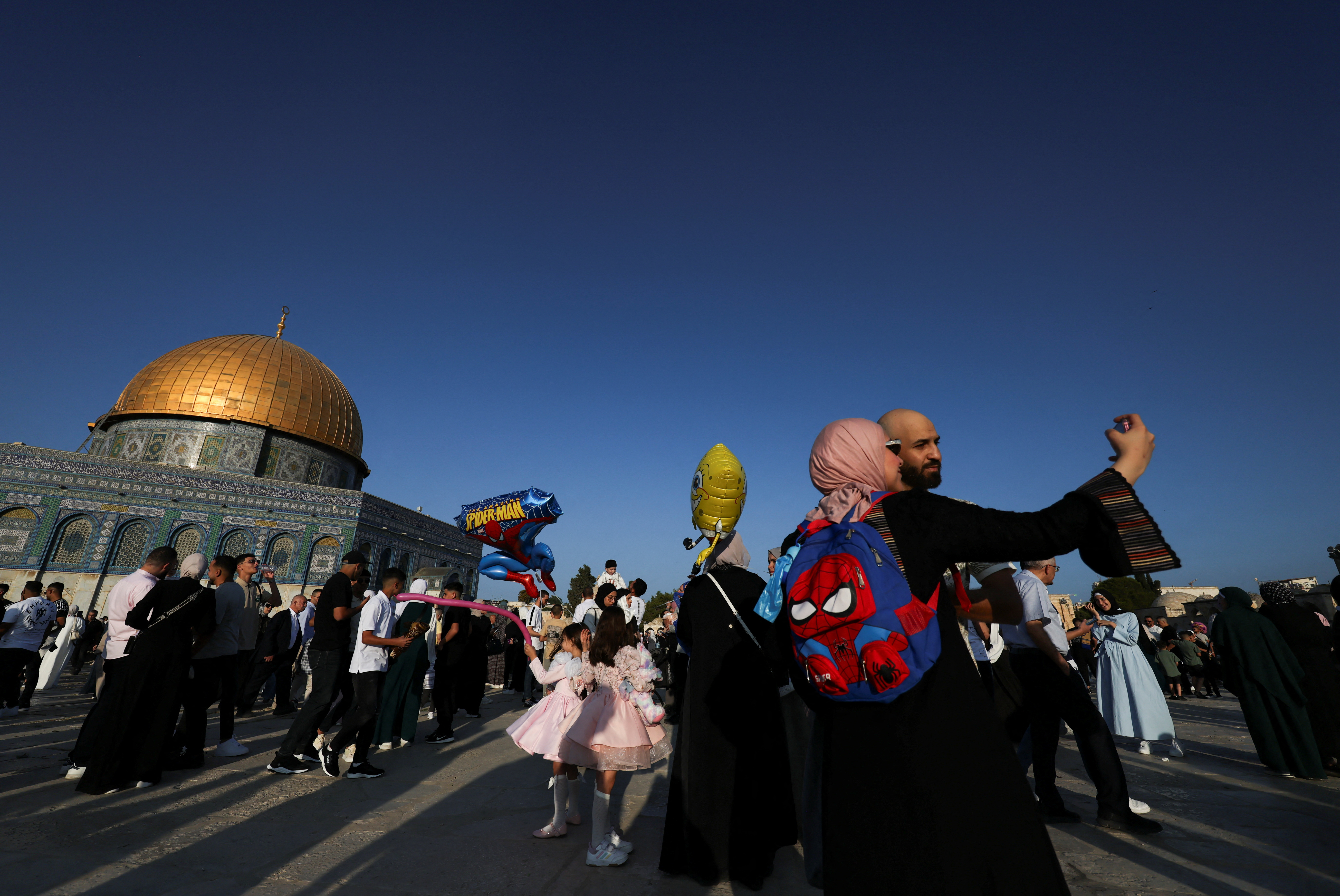Palestinians pray on the first day of the Muslim holiday of Eid al-Adha, in Jerusalem's Old City