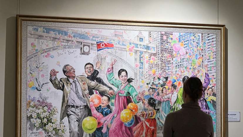 People visit an exhibition of North Korean art in Moscow