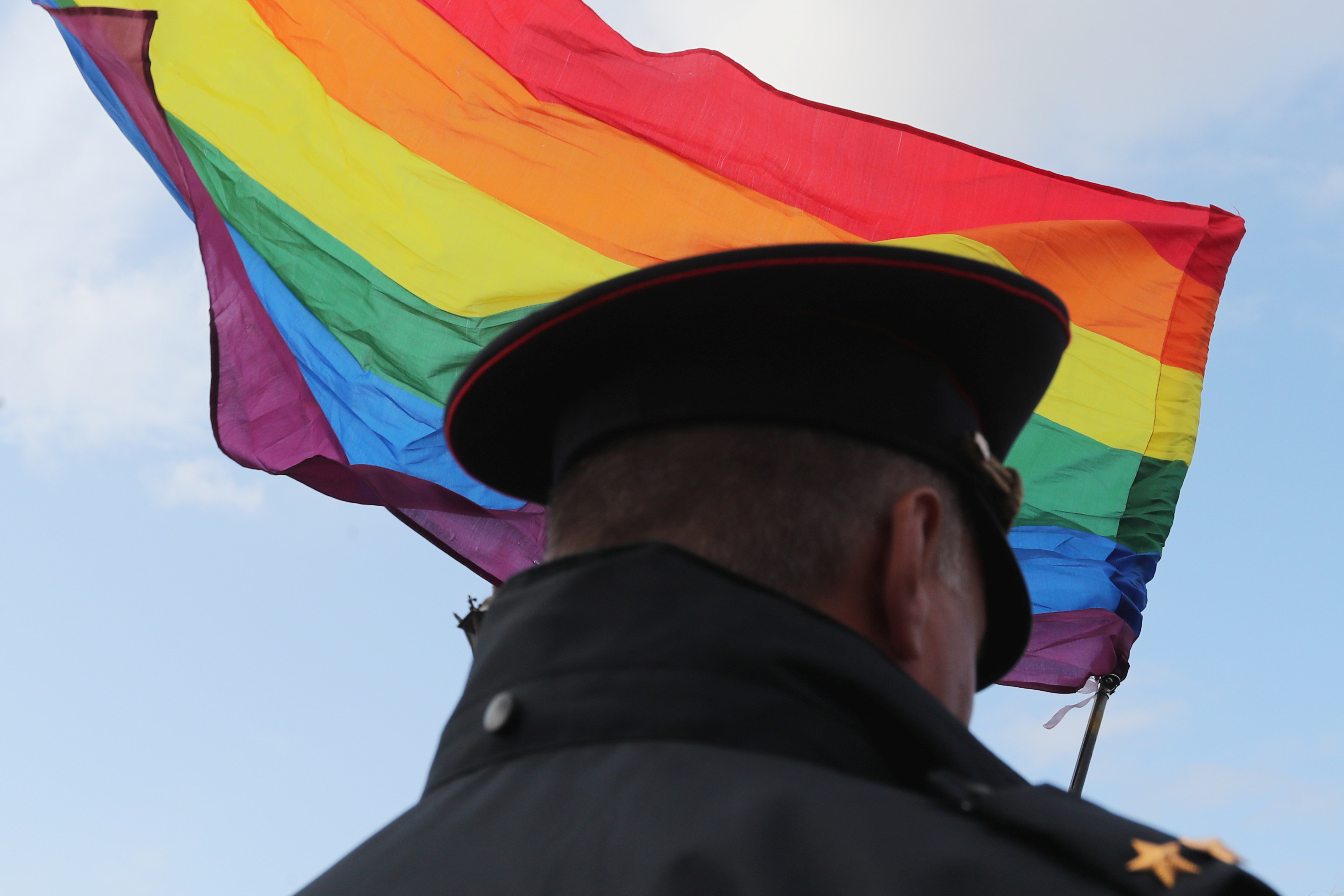 FILE PHOTO: A law enforcement officer stands guard during the LGBT community rally "X St.Petersburg Pride" in Saint Petersburg