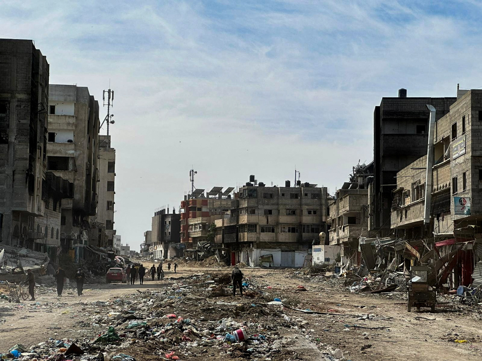 Residents inspect damages caused to Zeitoun neighborhood, in Gaza City