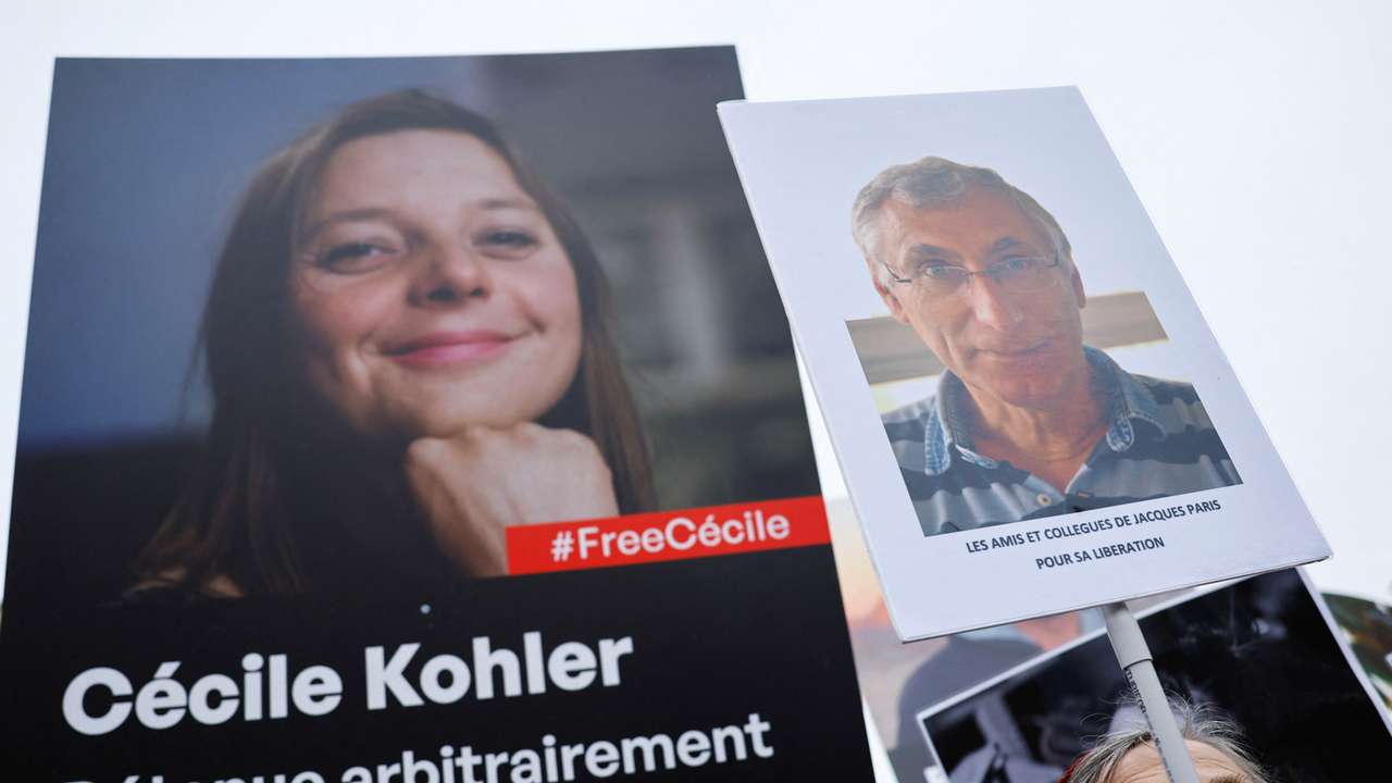 Supporters and relatives of French citizens detained in Iran gather in Paris