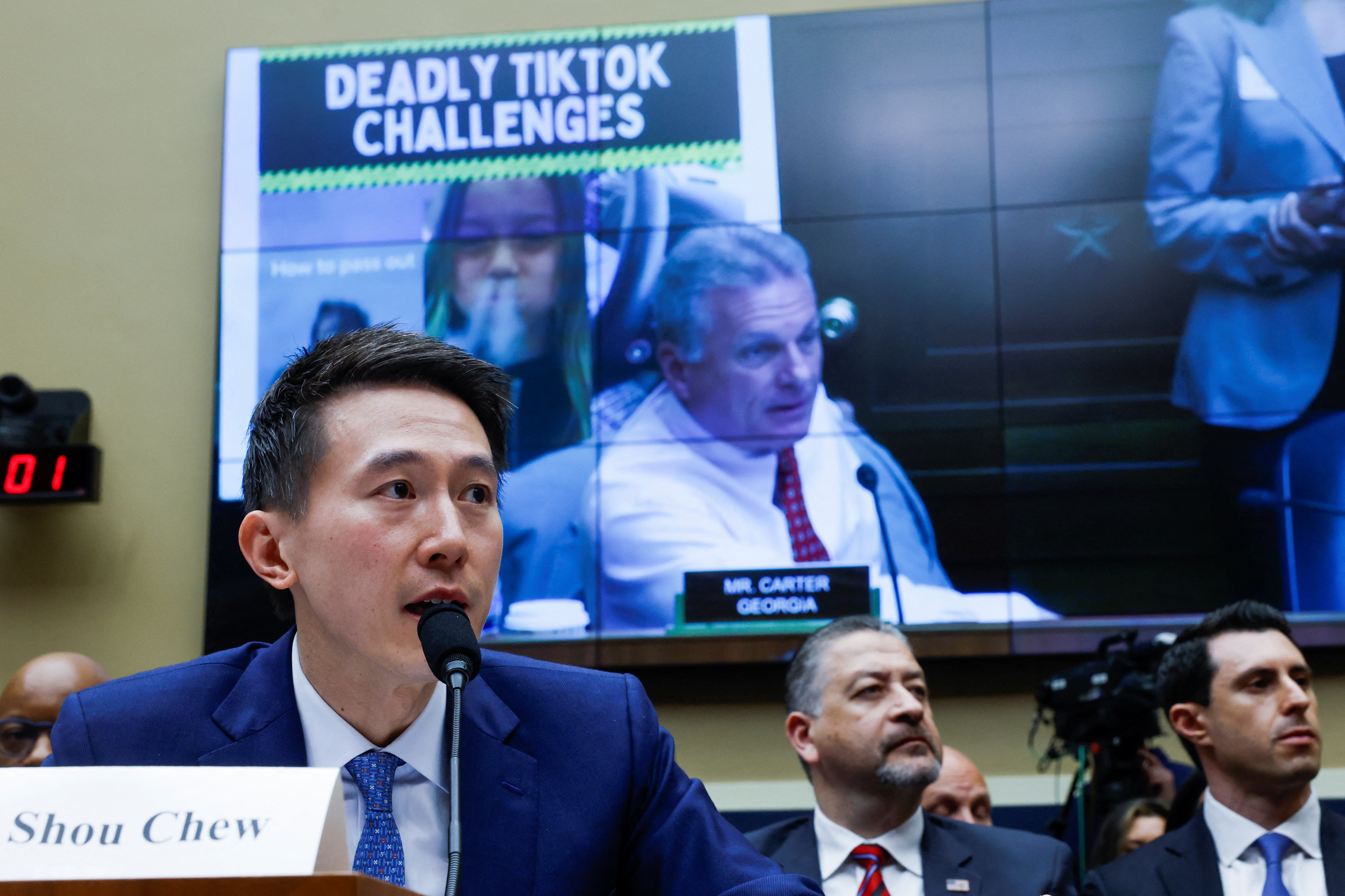 FILE PHOTO: TikTok Chief Executive Shou Zi Chew testifies before a House Energy and Commerce Committee, in Washington