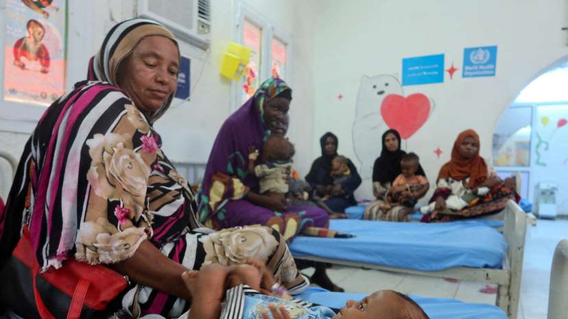 FILE PHOTO: Child suffering from malnutrition lies in hospital in Port Sudan