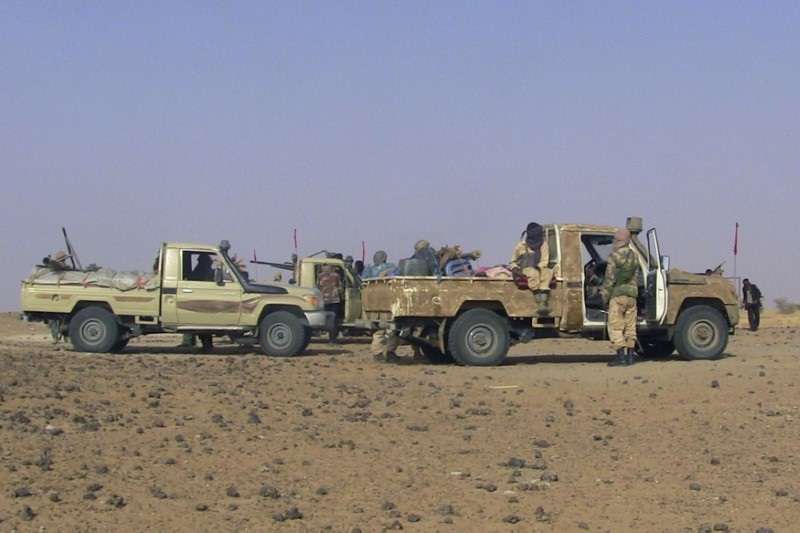 Fighters from the Tuareg separatist rebel group MNLA drive in the desert near Tabankort