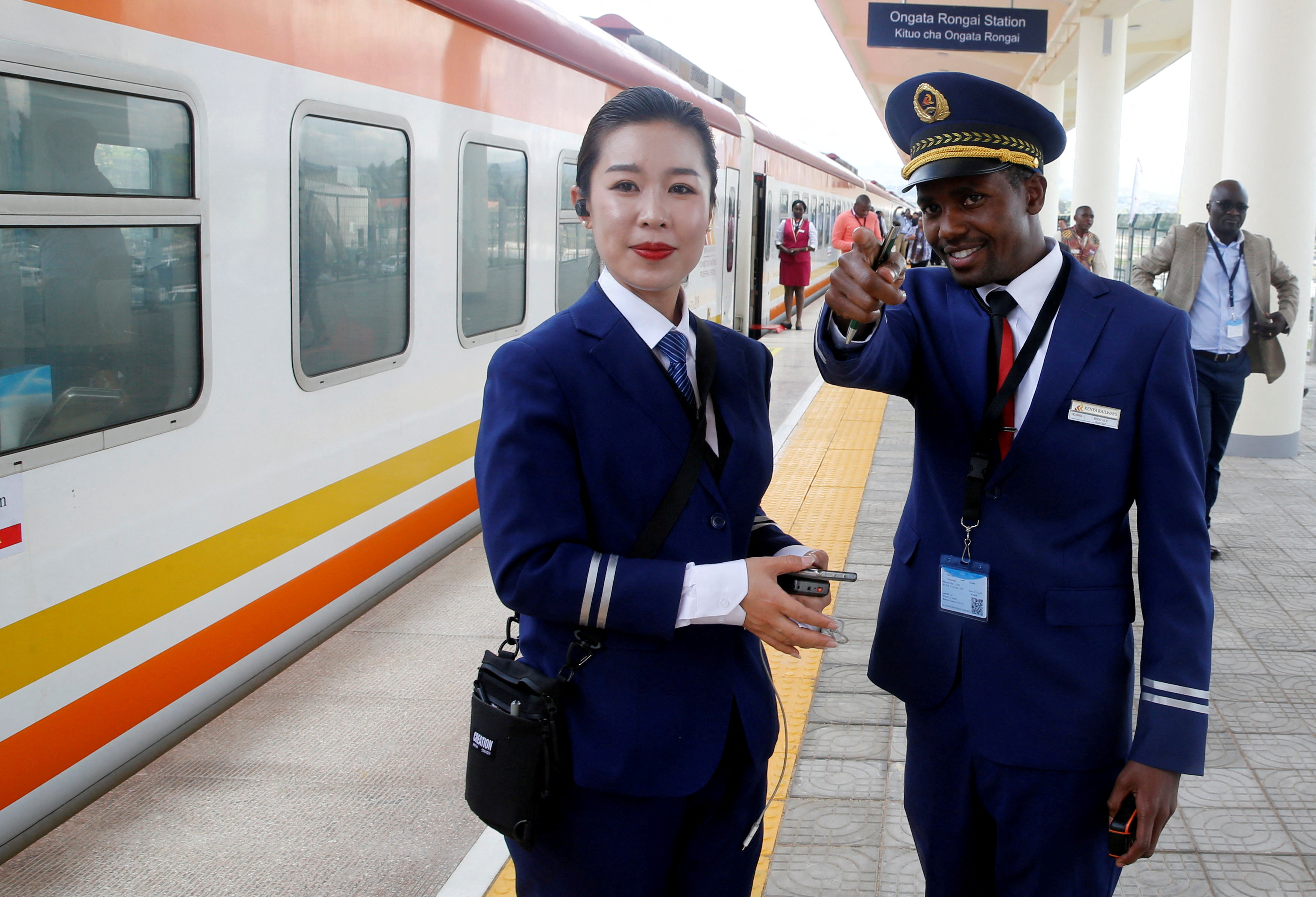 FILE PHOTO: Kenya Railways attendants talk next to a train along the Standard Gauge Railway (SGR) line constructed by the China Road and Bridge Corporation (CRBC) and financed by Chinese government in Ongata Rongai