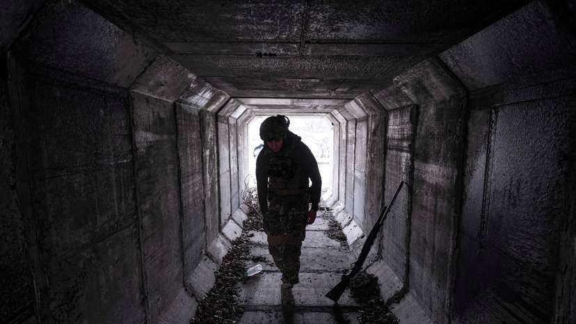 FILE PHOTO: Servicemen of the Ukrainian Armed Forces hides from Russian combat drone in the frontline city of Pokrovsk