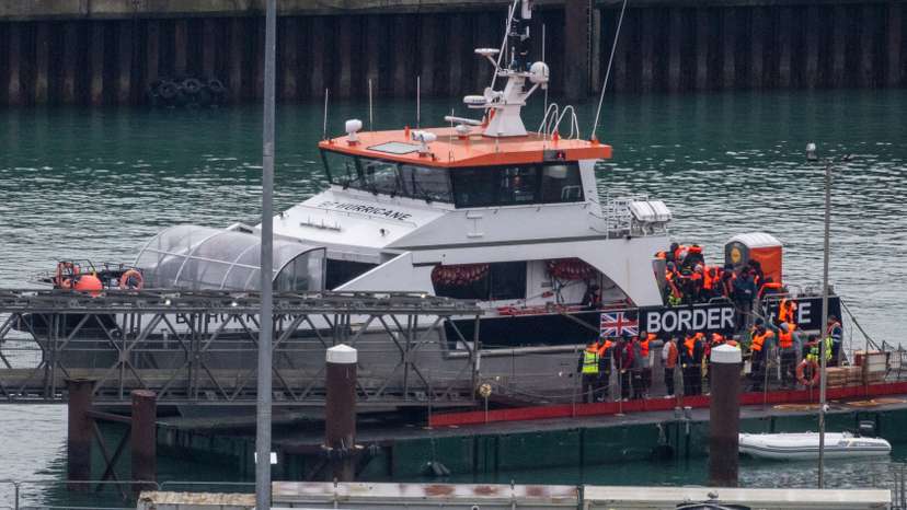 FILE PHOTO: Migrants arrive in the UK after crossing the English Channel