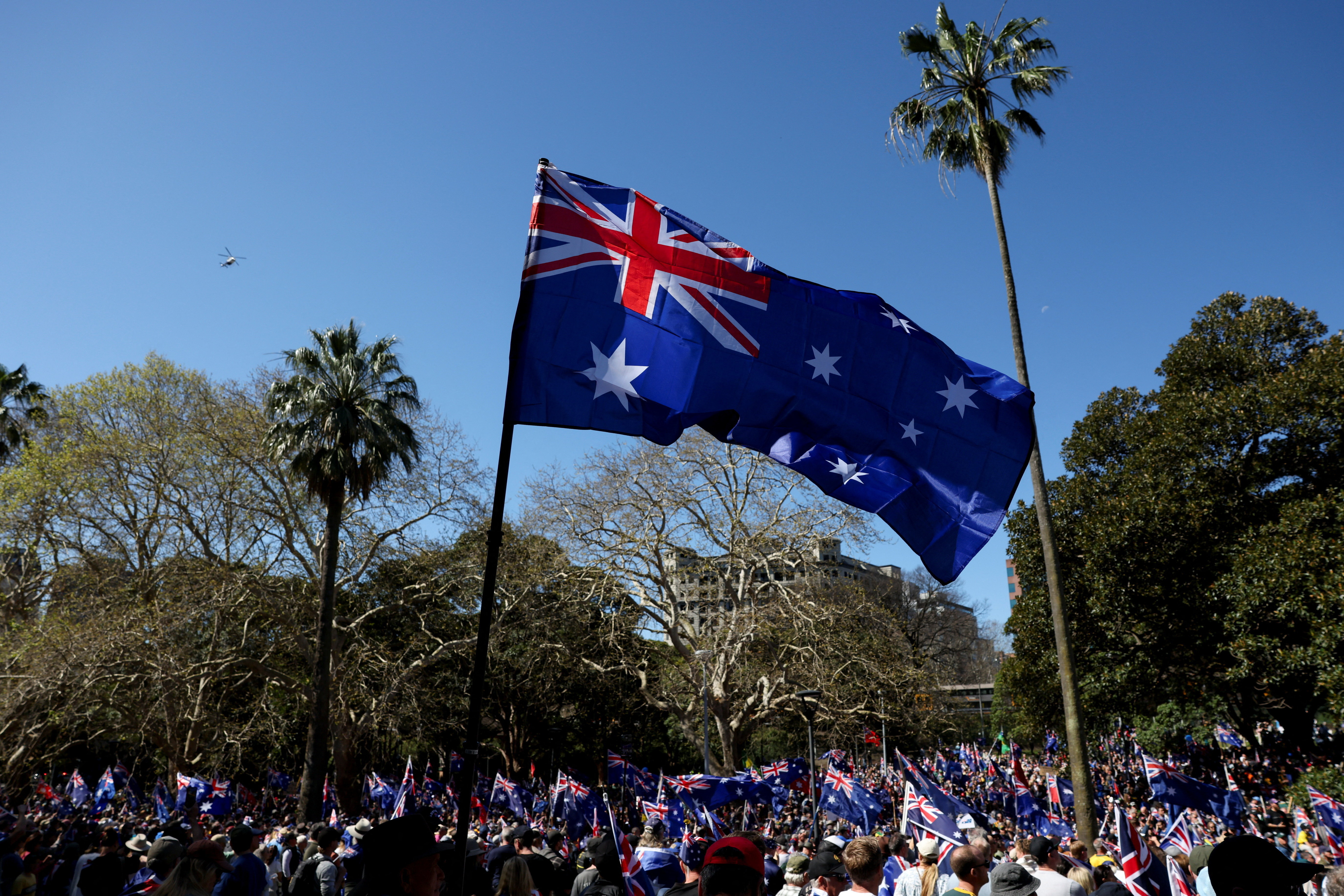 Demonstrators carry Australian flags during the ‘March for Australia’ anti-immigration protest in Sydney