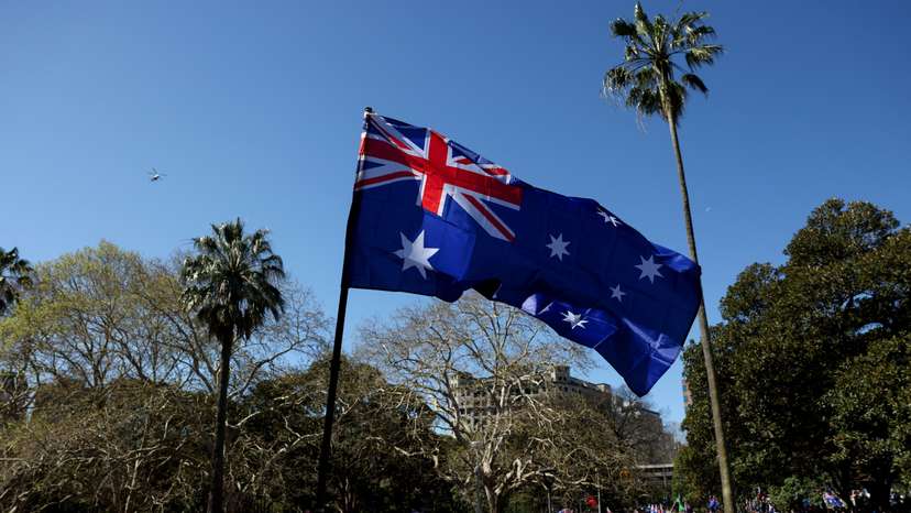 Demonstrators carry Australian flags during the ‘March for Australia’ anti-immigration protest in Sydney