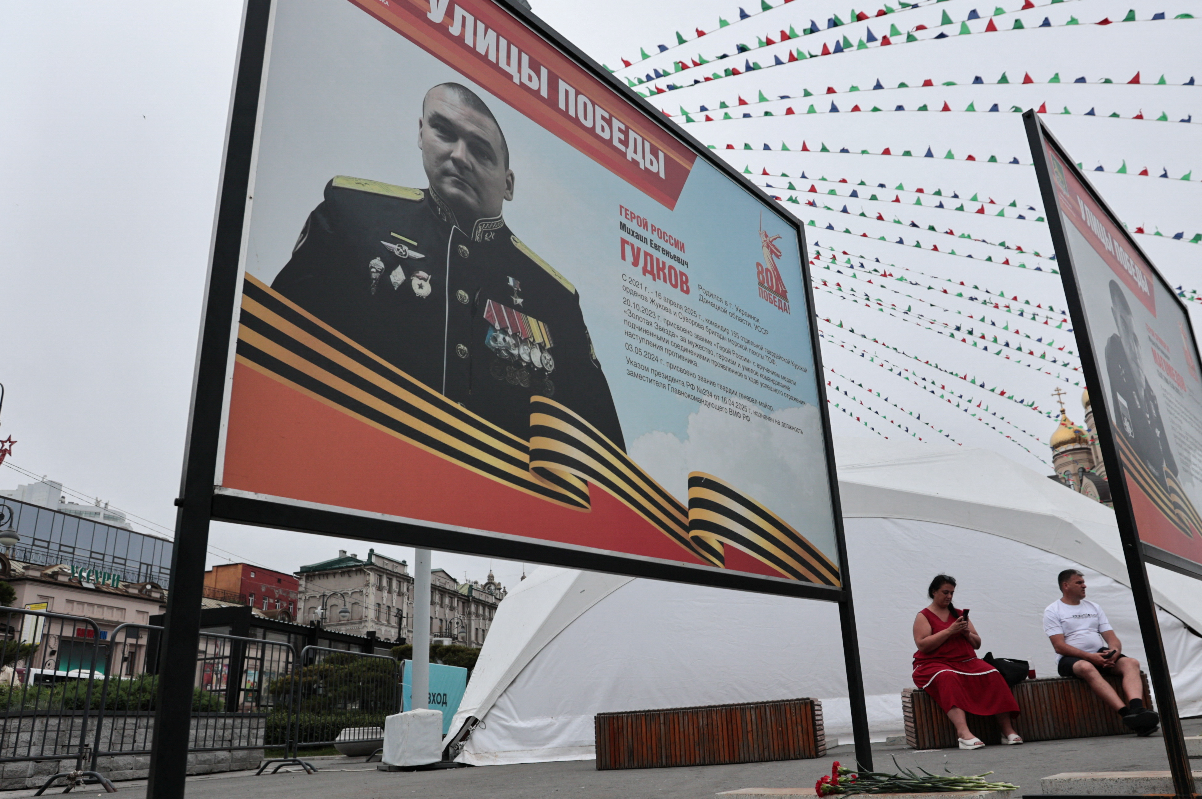 People in Vladivostok lay flowers near portrait of Russian Major General Gudkov reportedly killed amid Russia-Ukraine conflict