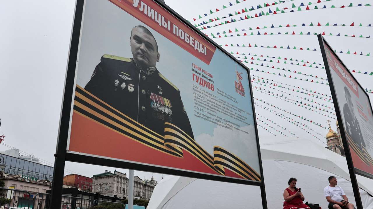 People in Vladivostok lay flowers near portrait of Russian Major General Gudkov reportedly killed amid Russia-Ukraine conflict