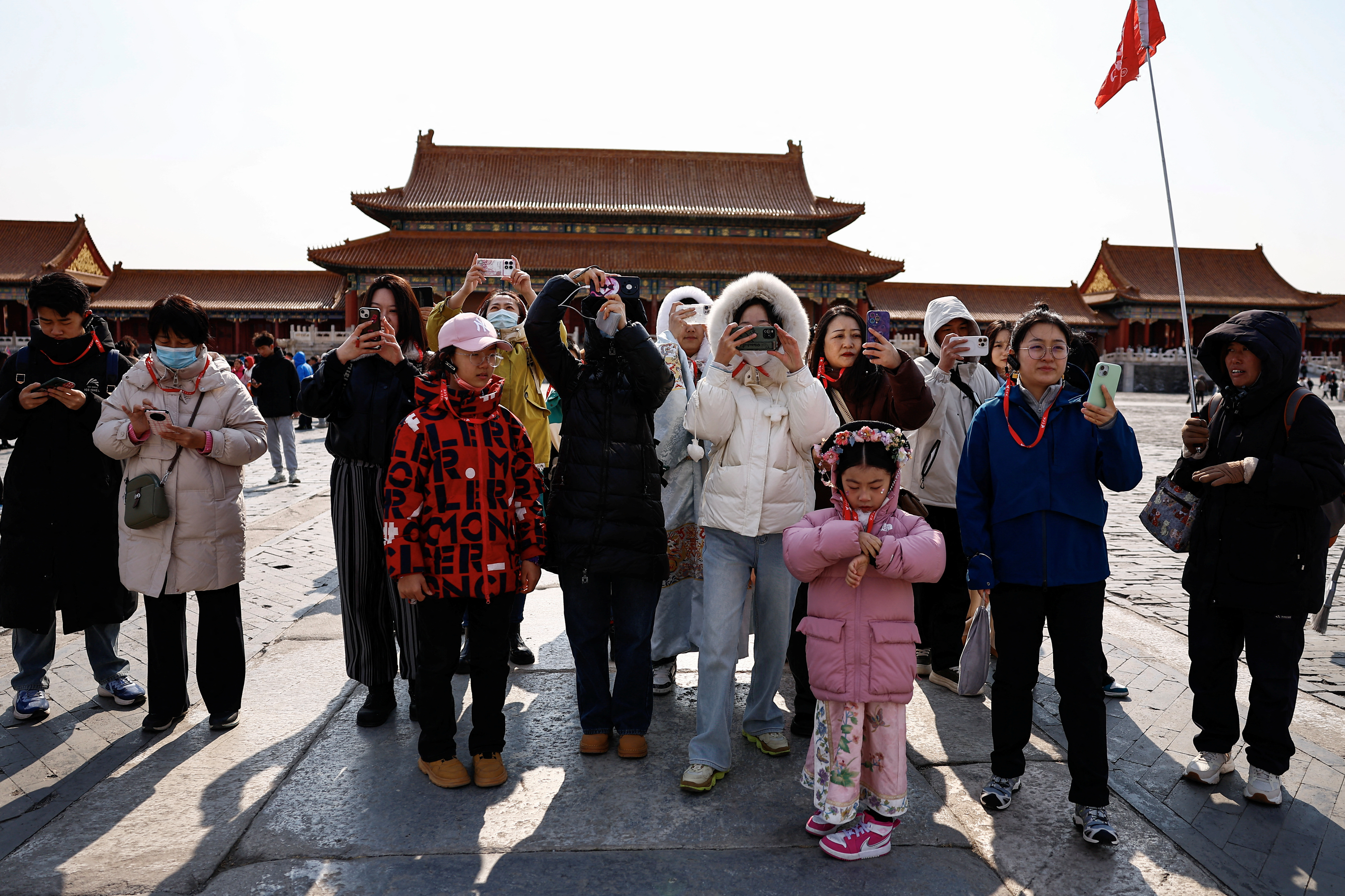 Tourists visit the Forbidden City in Beijing