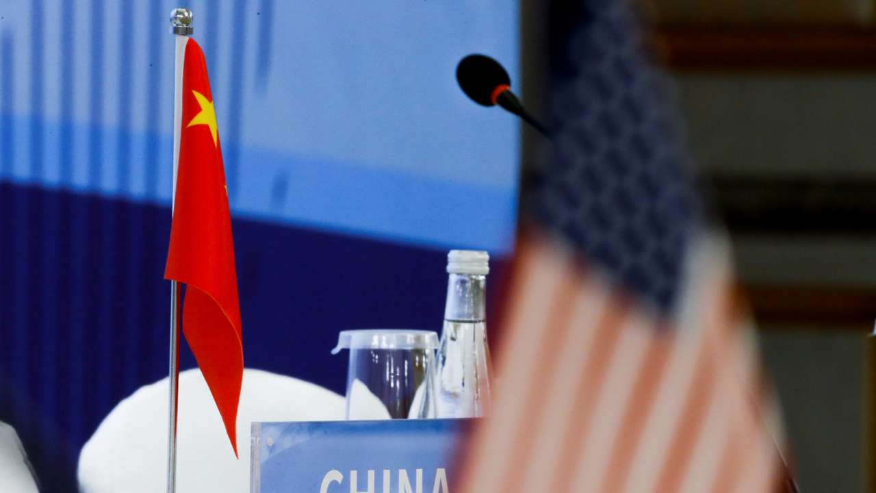 The Chinese and U.S. national flags are seen before the start of a P5 NPT conference in Beijing