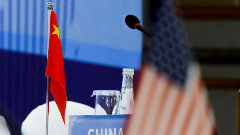 The Chinese and U.S. national flags are seen before the start of a P5 NPT conference in Beijing