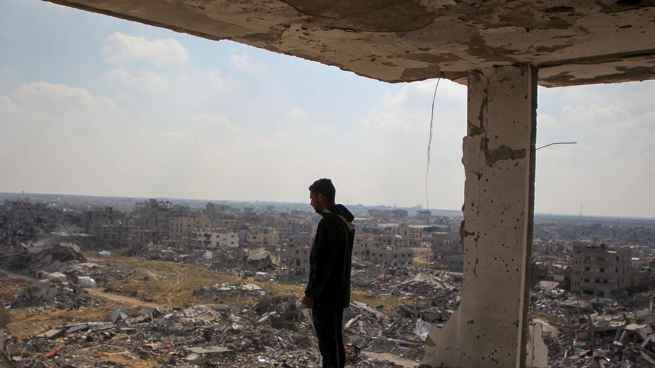 Palestinian man views the rubble of buildings destroyed during the Israeli offensive, amid a ceasefire between Israel and Hamas, in Rafah in the southern Gaza Strip