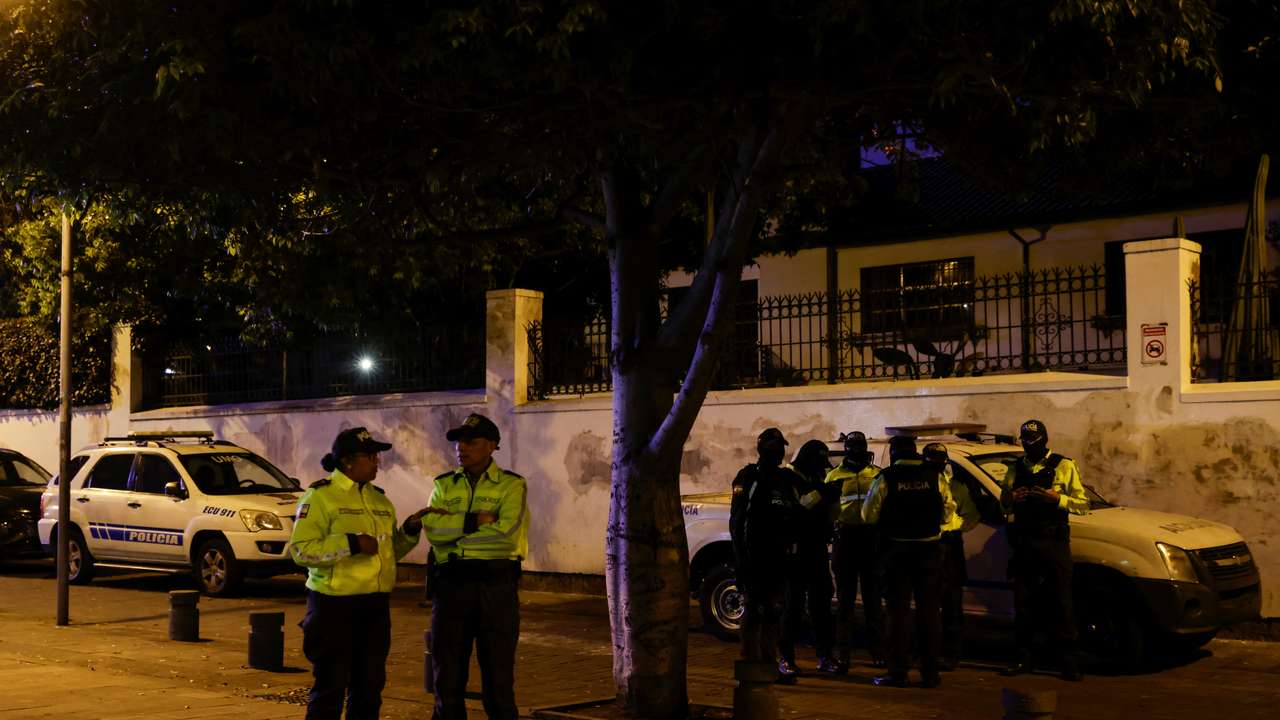 Ecuadorean police officers stand outside the Mexican embassy where they forcibly removed the former Ecuador Vice President Jorge Glas in Quito