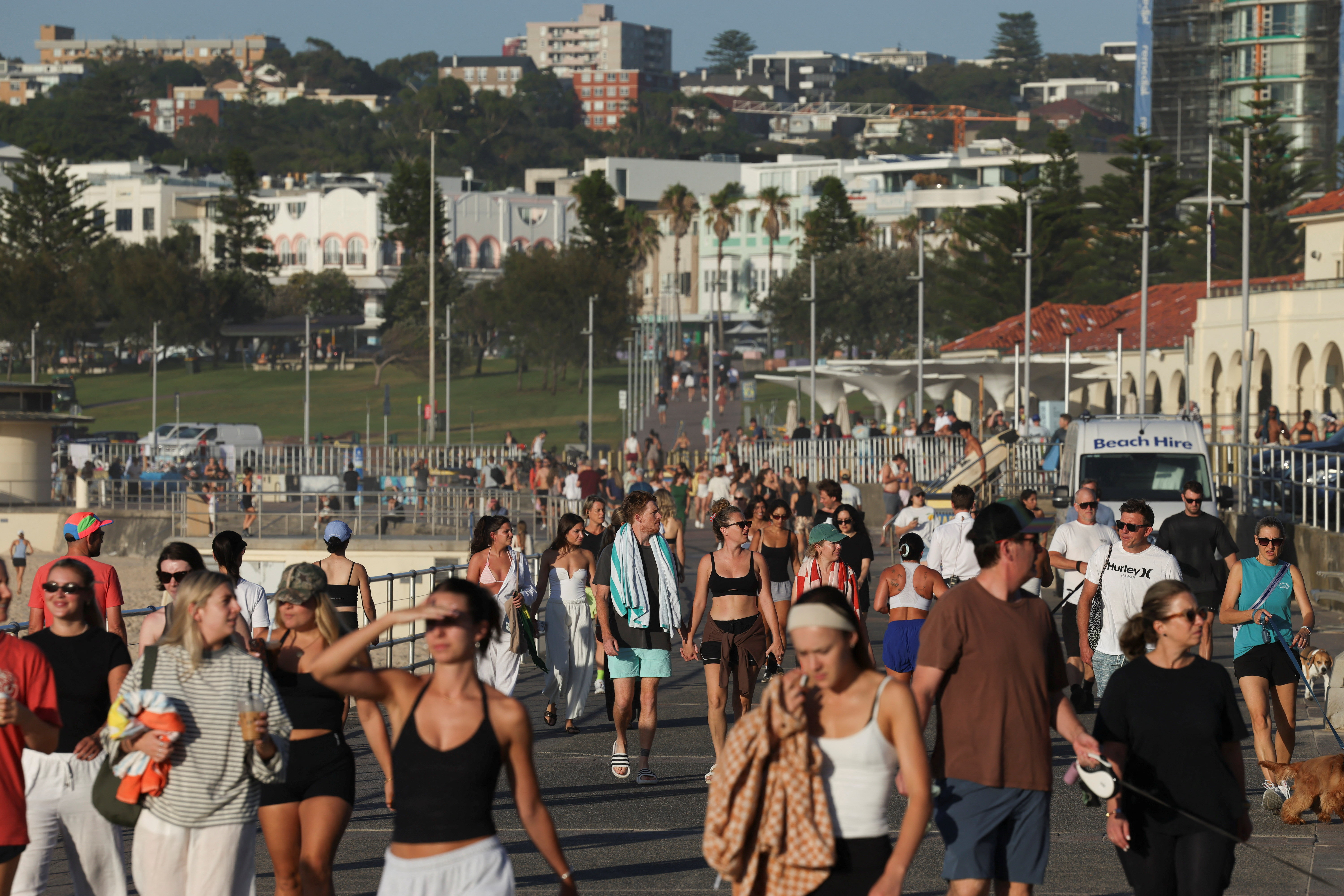 People visit the crime scene after it was reopened following the mass shooting at Bondi Beach