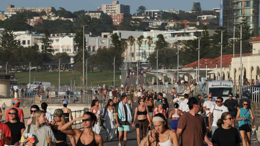 People visit the crime scene after it was reopened following the mass shooting at Bondi Beach