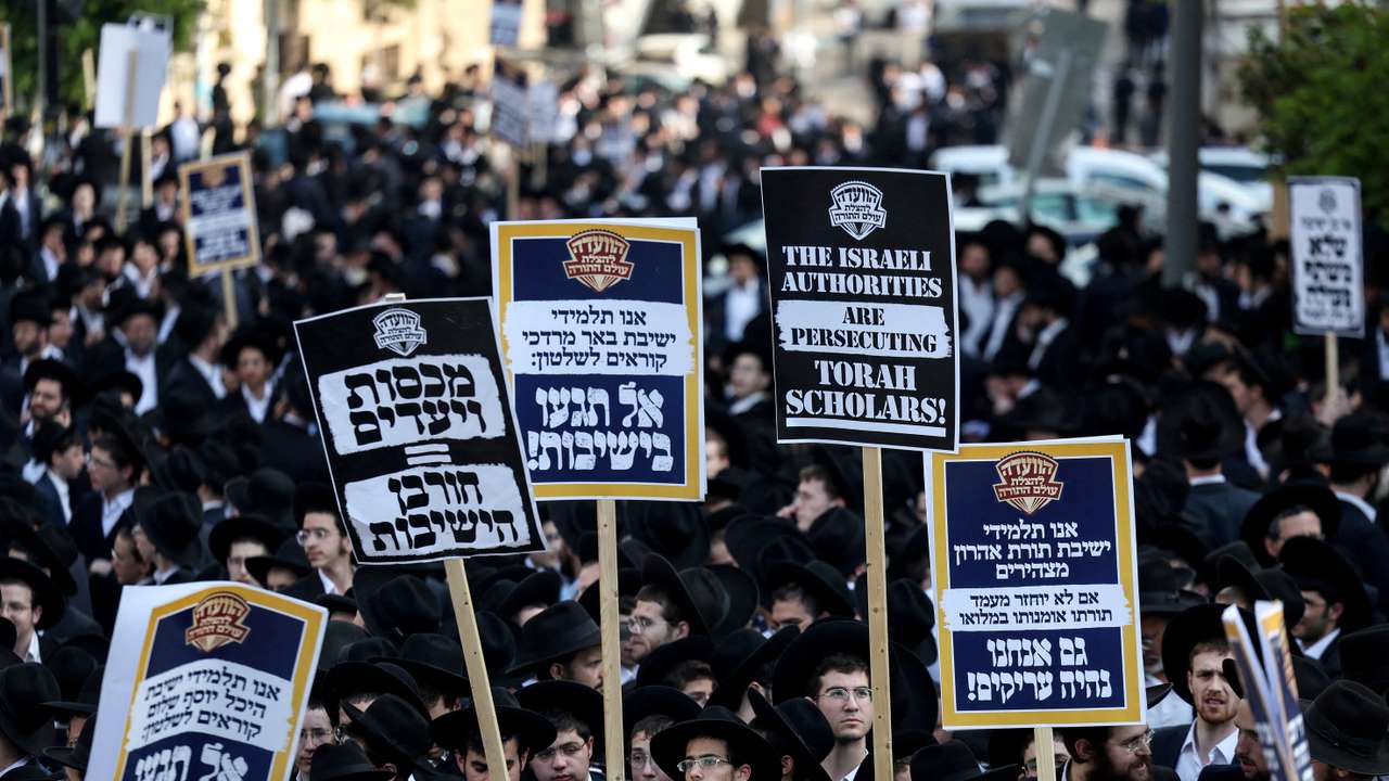 FILE PHOTO: Ultra-Orthodox Jewish men protest against attempts to change government policy that grants ultra-Orthodox Jews exemptions from military conscription, in Jerusalem
