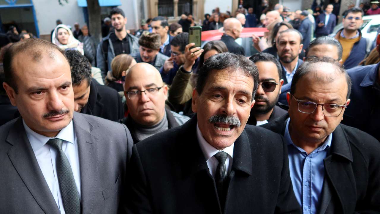 Tunisian prominent activist, Ayachi Hammami, speaks outside a court in Tunis