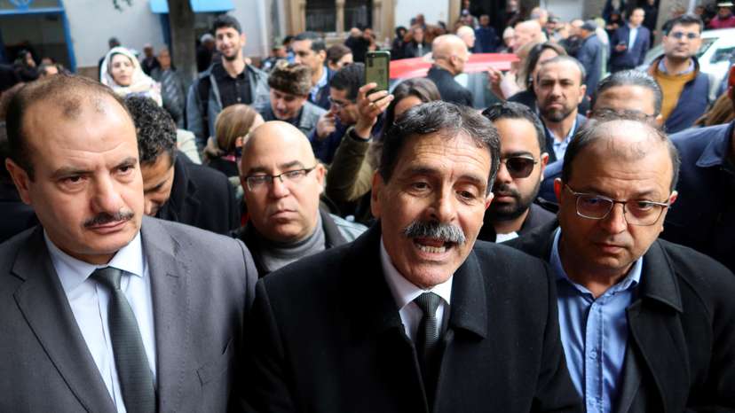 Tunisian prominent activist, Ayachi Hammami, speaks outside a court in Tunis