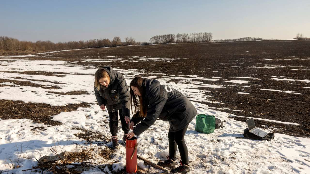 FILE PHOTO: Environmental experts test the groundwater level at the Polokhivske lithium deposit that will be developed by Ukrlithium Mining in the Malovyskivsky district of Ukraine