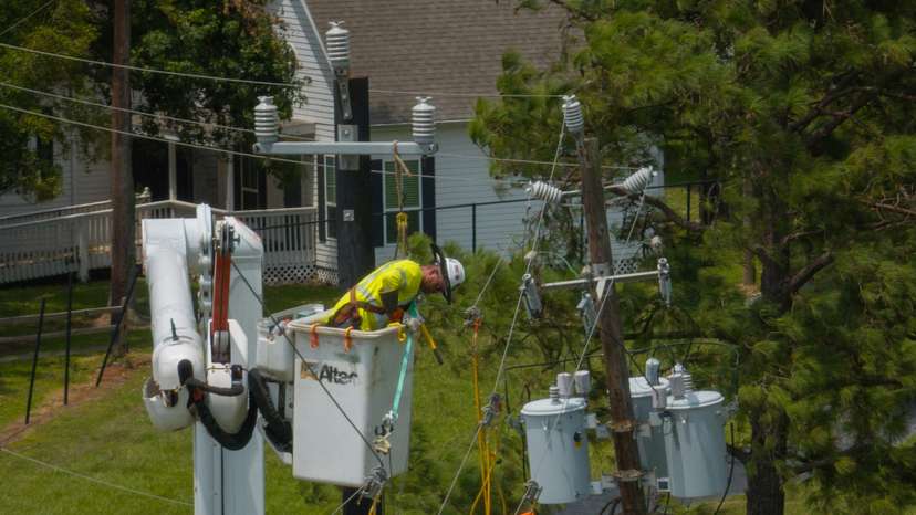Worker repairs power lines in the aftermath of Hurricane Beryl in Seabrook, Texas
