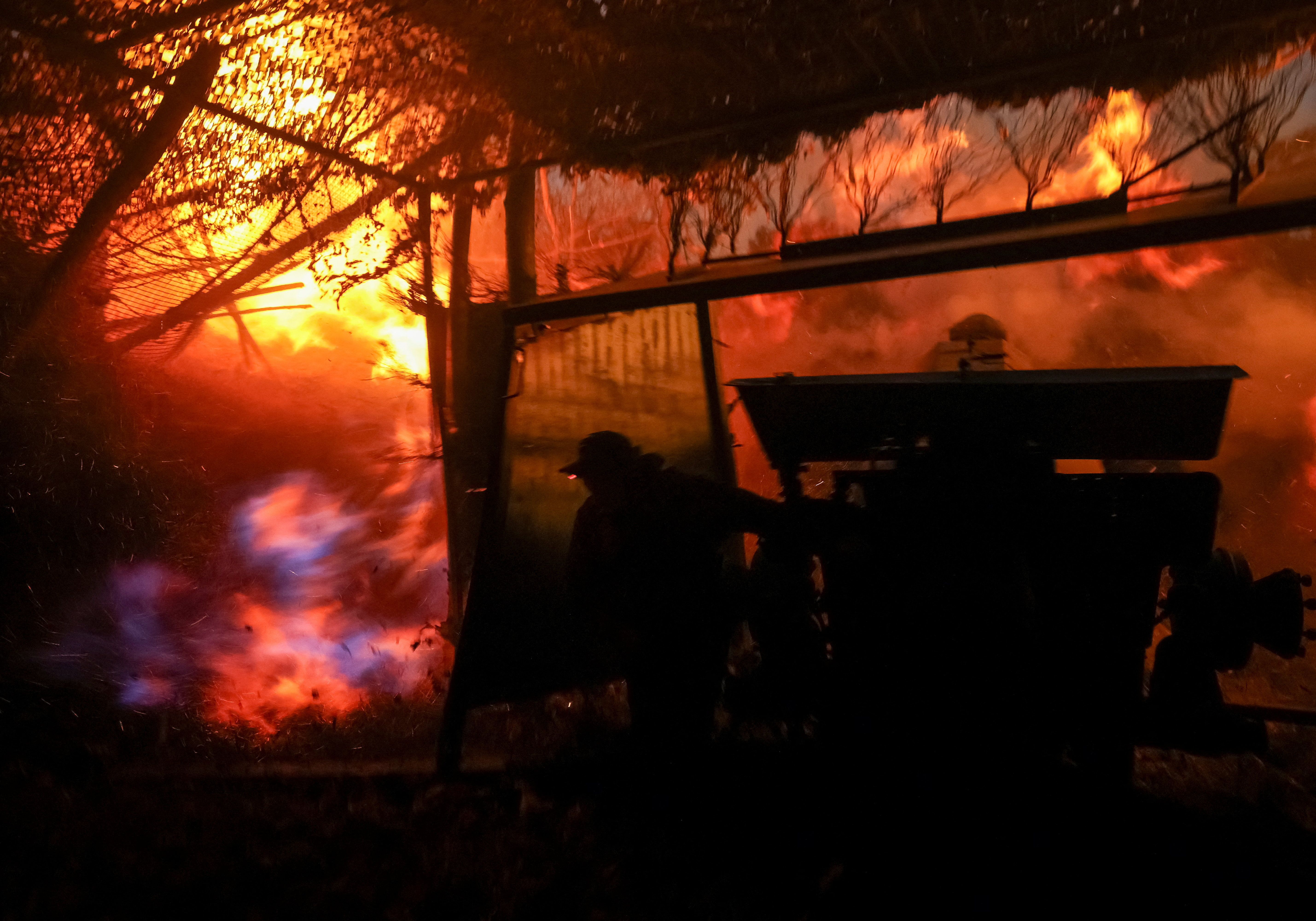 Ukrainian serviceman fires a howitzer towards Russian troops near the frontline town of Kupiansk