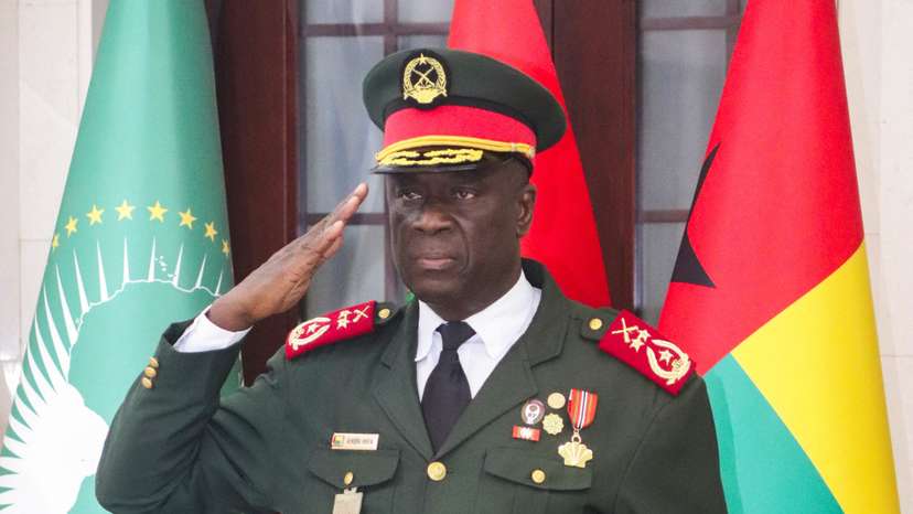 Major-General Horta Inta-a, the new transitional president, salutes during the swearing-in ceremony of Major-General Tomas Djassi in Bissau