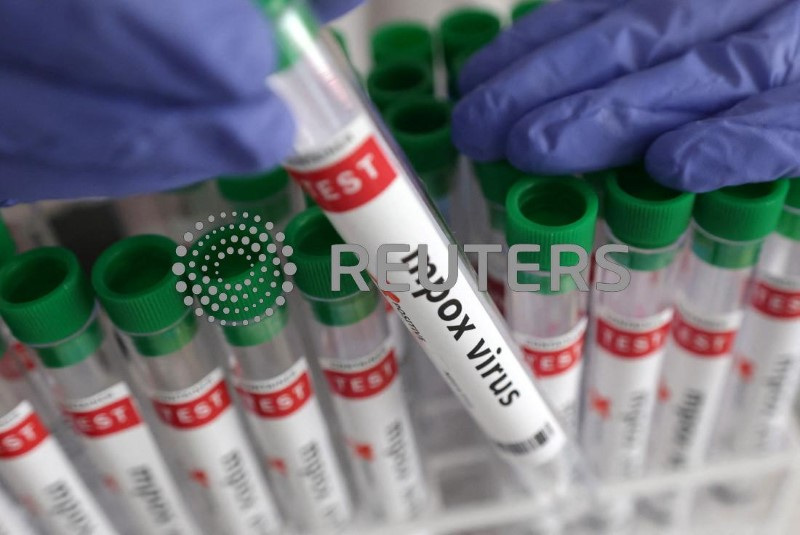 Illustration shows test tubes with "Mpox virus positive" label