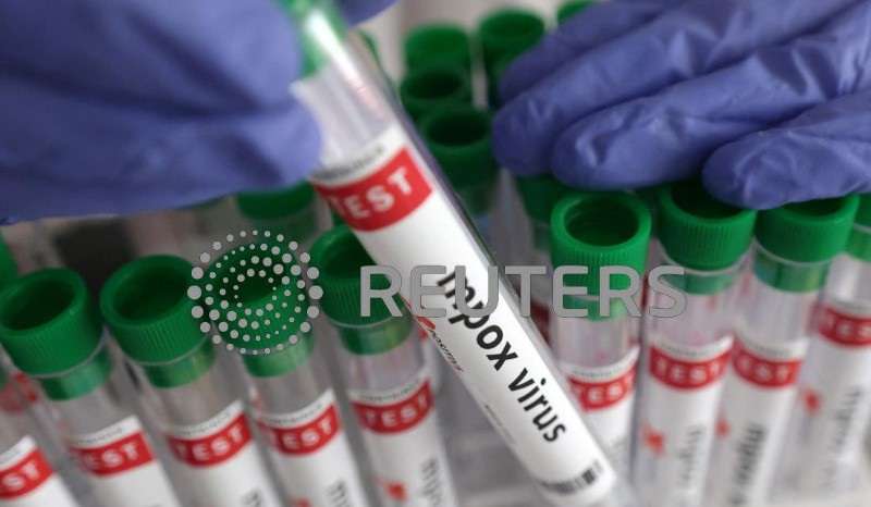 Illustration shows test tubes with "Mpox virus positive" label