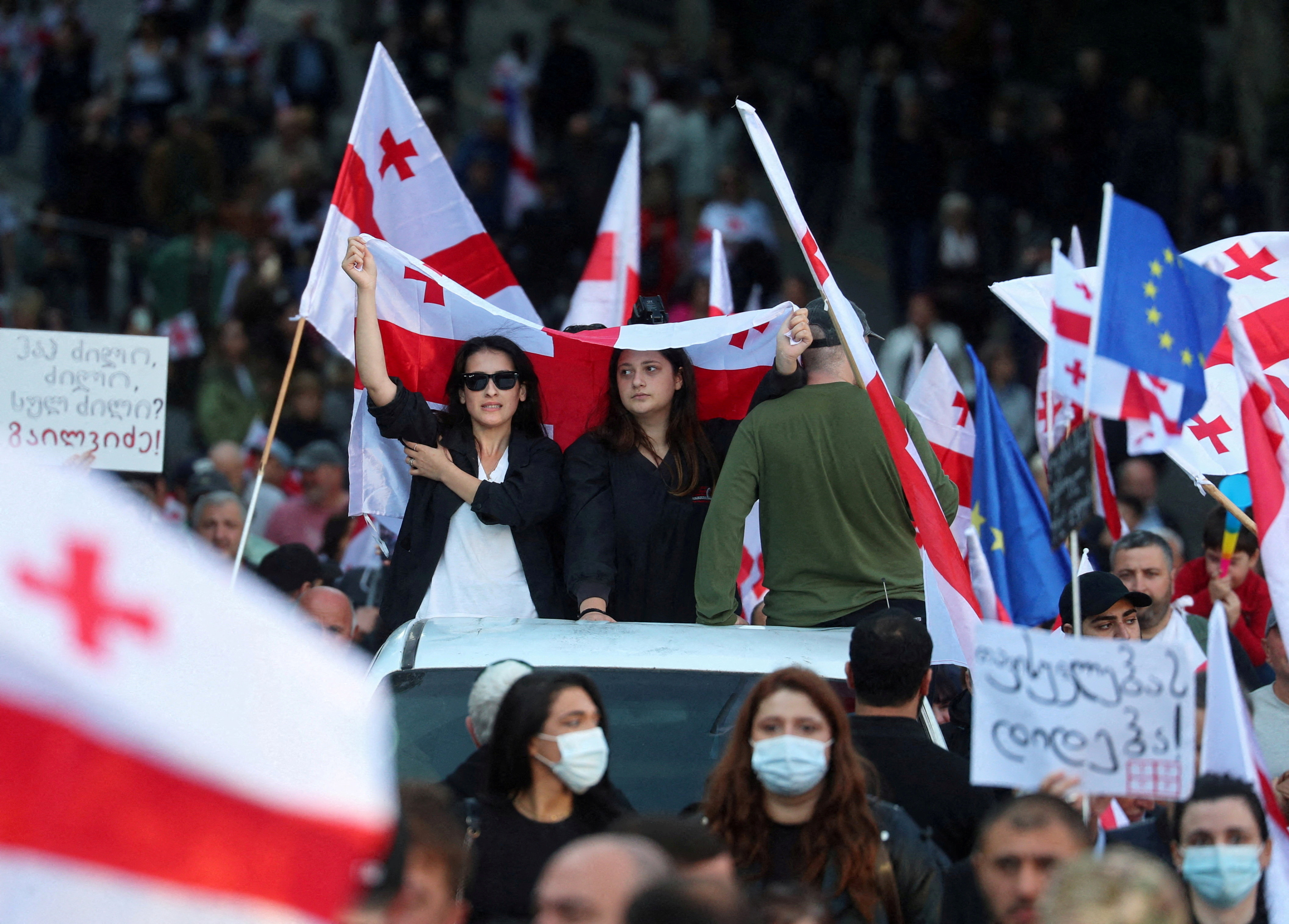 FILE PHOTO: Opposition supporters hold a rally on the day of local elections in Tbilisi