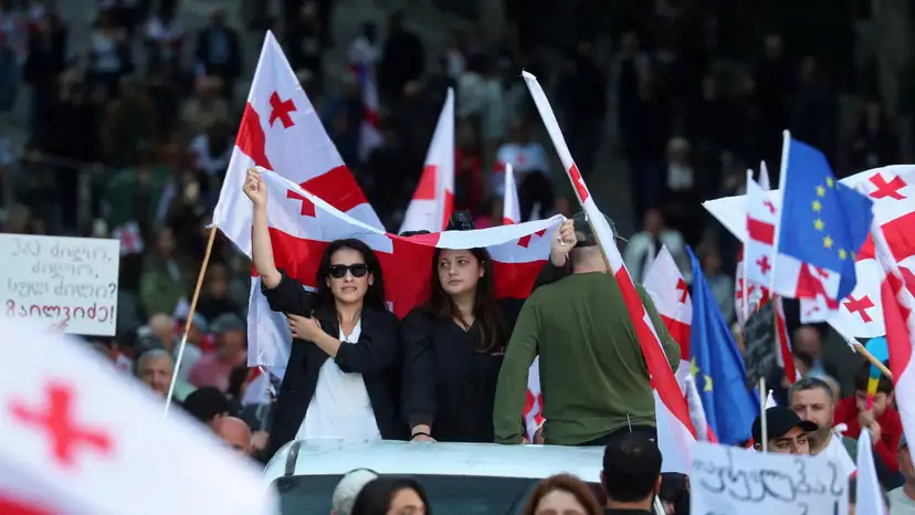 FILE PHOTO: Opposition supporters hold a rally on the day of local elections in Tbilisi