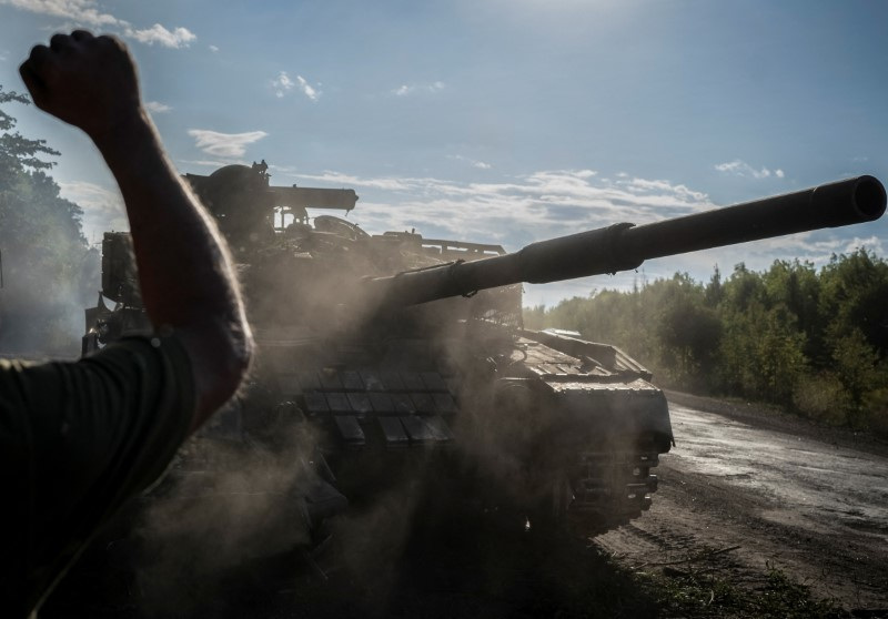 Ukrainian serviceman operates a tank near the Russian border in Sumy region