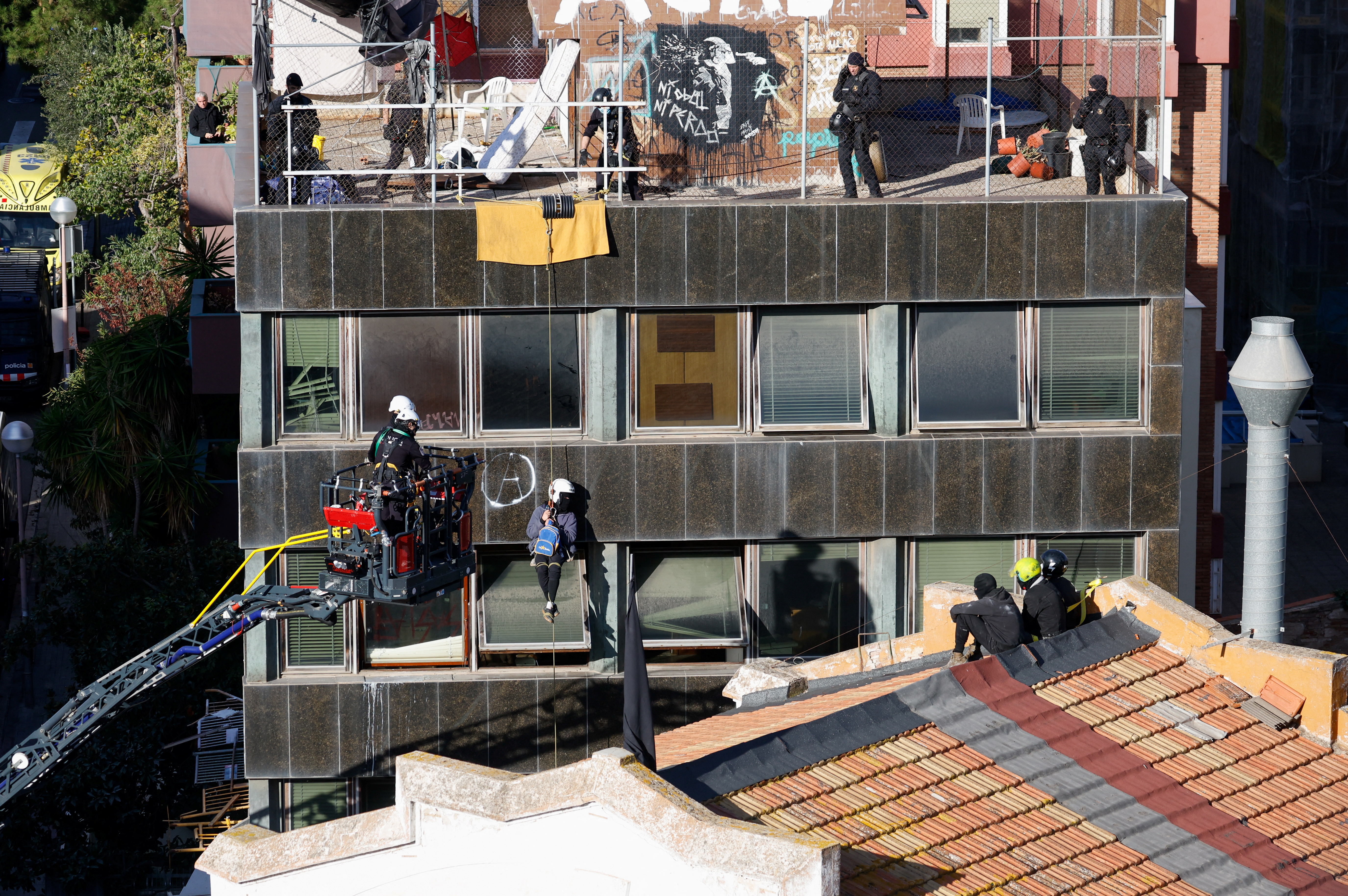 Police officers prepare to evict squatted buildings of Kubo and La Ruina in Barcelona