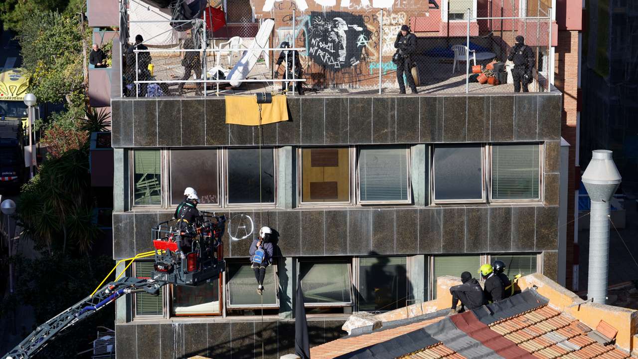 Police officers prepare to evict squatted buildings of Kubo and La Ruina in Barcelona
