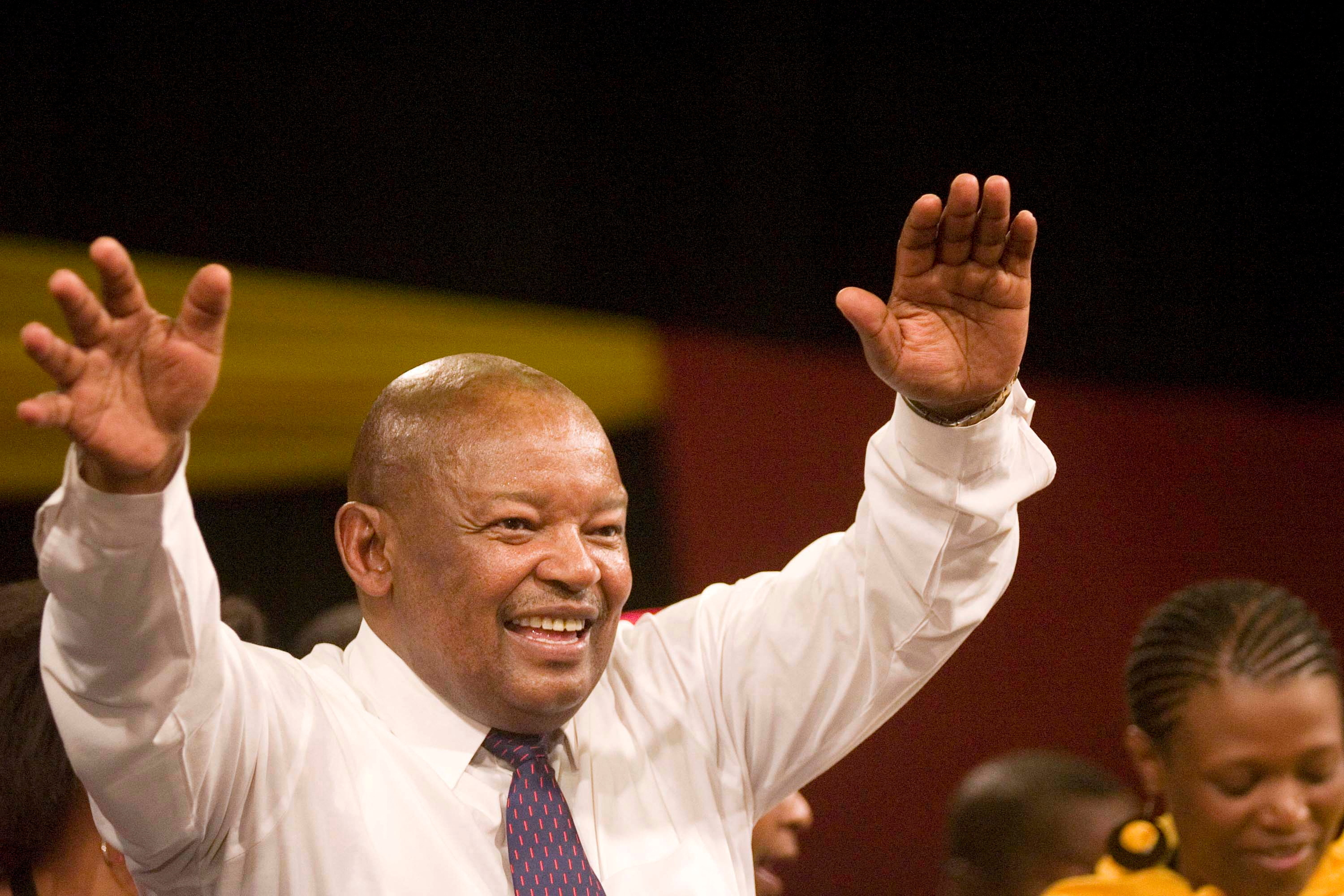FILE PHOTO: Former South African Defence Minister Mosiuoa Lekota waves to supporters after being elected leader of COPE in Bloemfontein