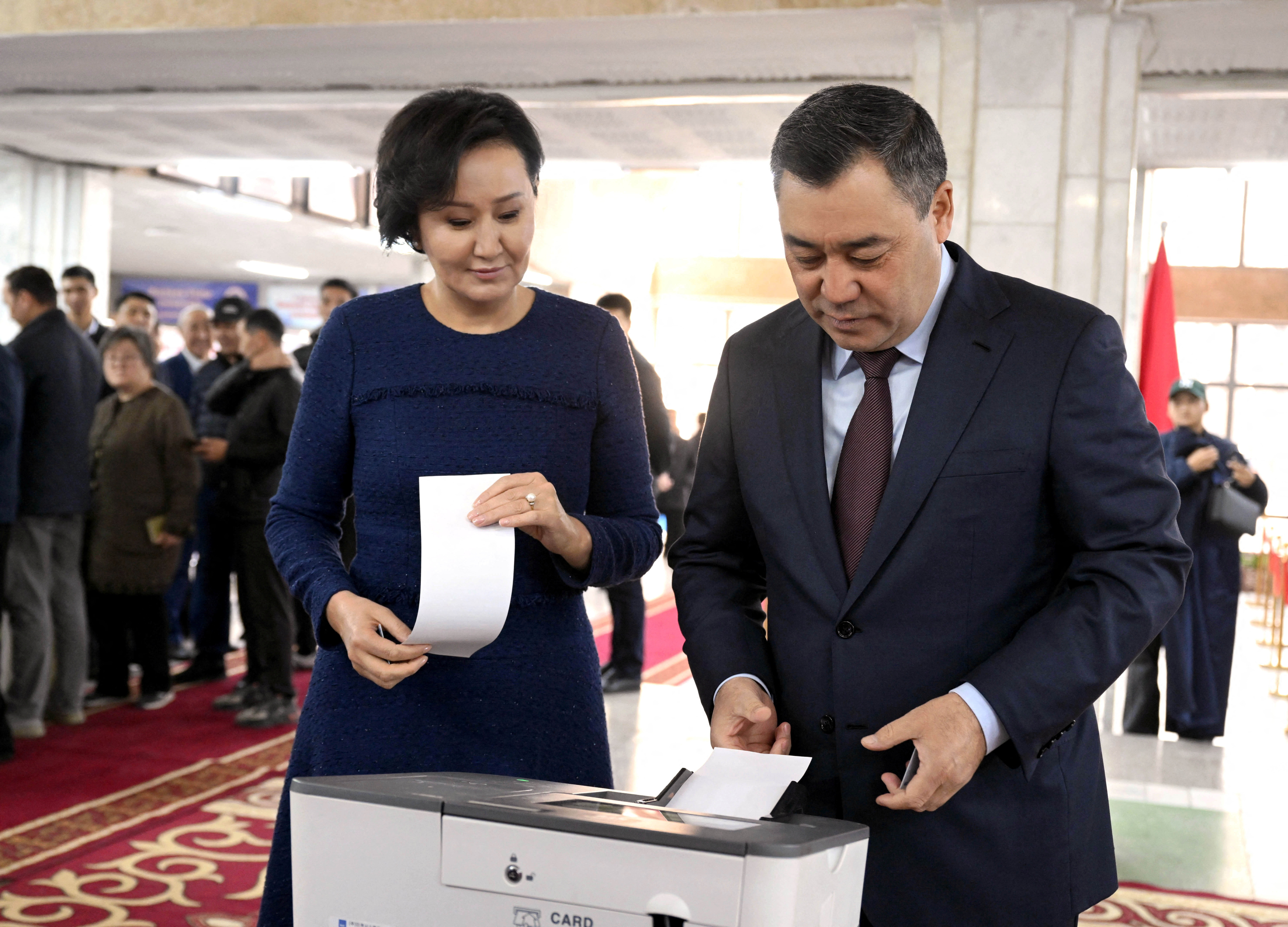 Kyrgyz President Sadyr Japarov visits a polling station during the snap parliamentary election in Bishkek