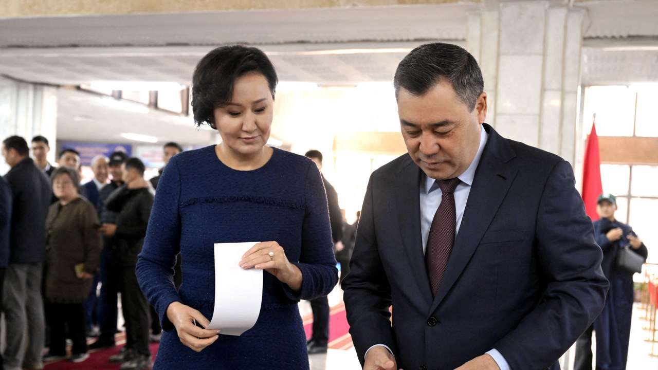Kyrgyz President Sadyr Japarov visits a polling station during the snap parliamentary election in Bishkek