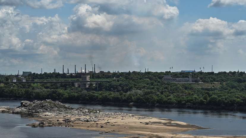 View shows the city skyline and a rocky island in the Dnipro river which became visible again after water level sharply dropped following Kakhovka dam destruction, in Zaporizhzhia