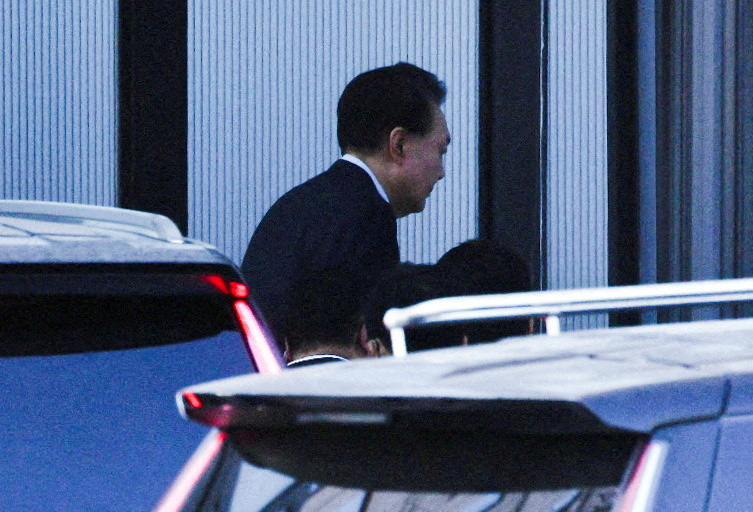 FILE PHOTO: South Korean investigators arrest impeached President Yoon