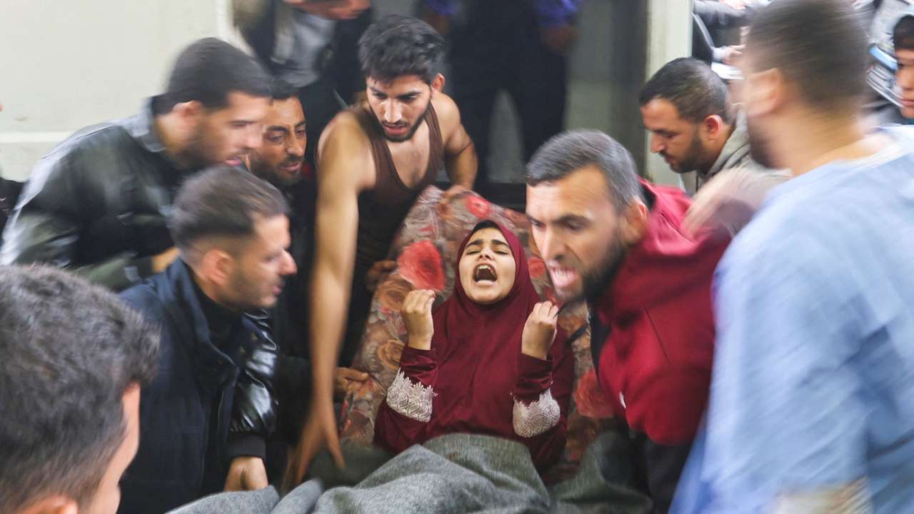 Wounded Palestinians are rushed into Nasser hospital, in Khan Younis