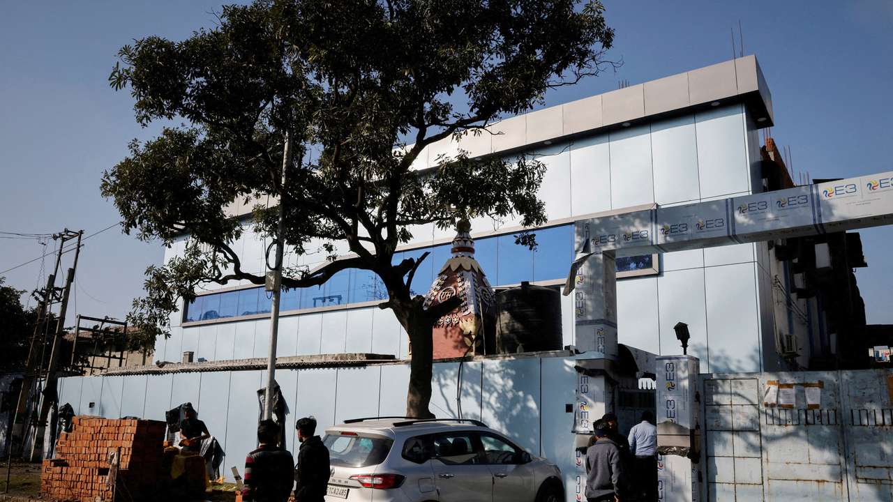 FILE PHOTO: People stand outside the Maiden Pharmaceuticals plant in Sonipat in the northern state of Haryana, India,