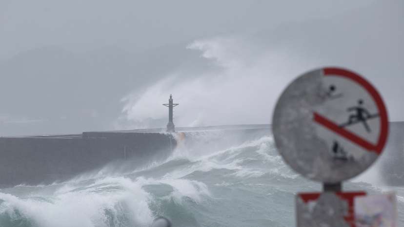 Waves break against the protecting walls as Typhoon Gaemi approaches in Keelung