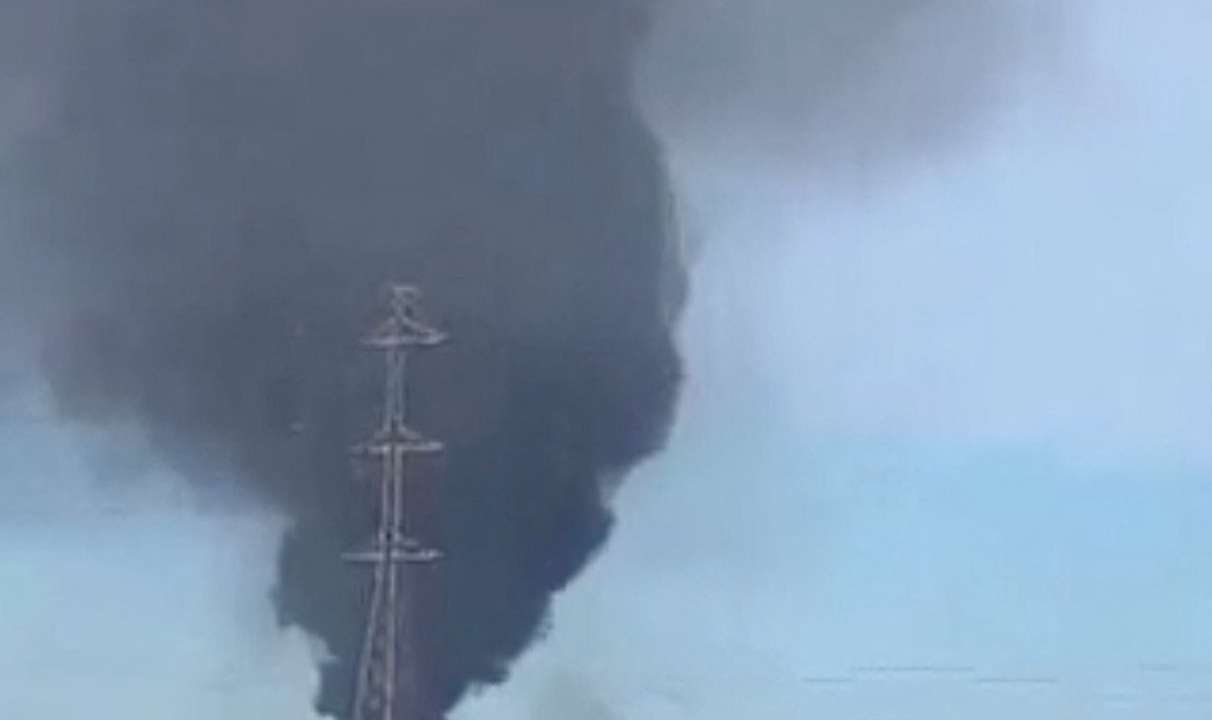 Smoke rises from the international airport that was attacked by insurgents in Bamako
