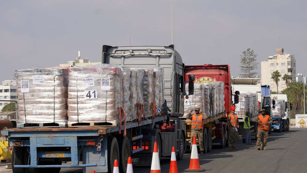 Lorries with aid loads for delivery into Gaza arrive at Larnaca Port