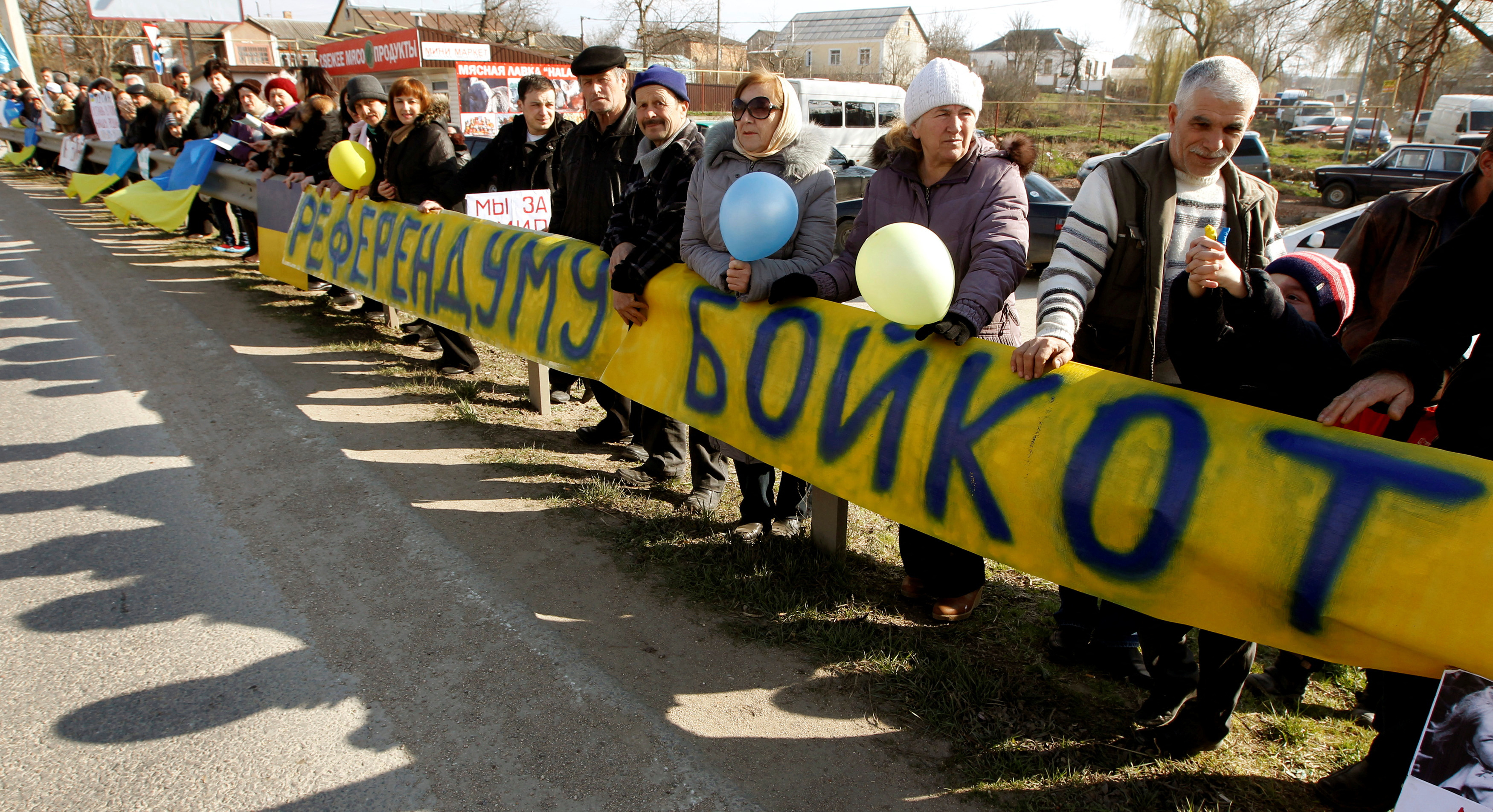 Crimean Tatars take part in a pro-Ukranian meeting in the Crimean village of Eskisaray