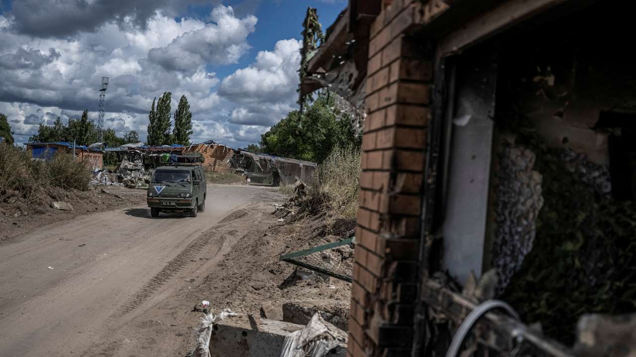 FILE PHOTO: Ukrainian soldiers ride a military vehicle near the Russian border in Sumy region
