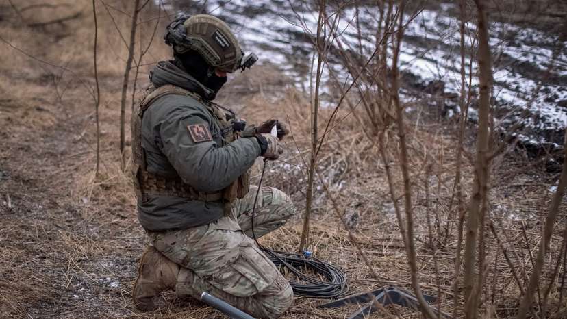 FILE PHOTO: A Ukrainian serviceman of 47th brigade prepares a Starlink satellite internet systems at his positions at a front line the town of Avdiivka